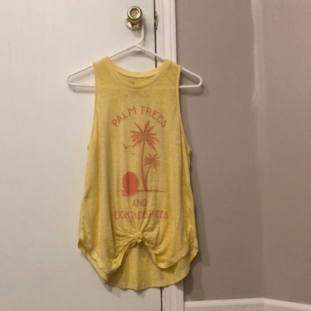 yellow tank top with orange lettering